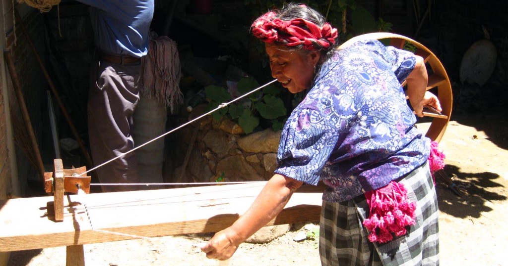 Weaver Paulina Chávez Gutiérrez spinning wool - Teotitlan del Valle, Oaxaca, Mexico Weaver Paulina Chávez Gutiérrez spinning wool in Teotitlan, Oaxaca, Mexico