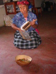 Weaver Paulina Chávez Gutiérrez cards wool, shows her natural dyes in Teotitlan, Oaxaca, Mexico