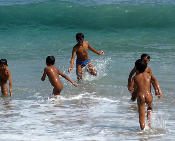 Beach boys in Candidasa, Bali, Indonesia