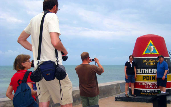 Southernmost marker with tourists in Key West, Florida, USA