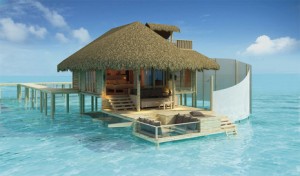 Overwater bungalow suite at eco-friendly Six Senses Laamu resort in the Maldives